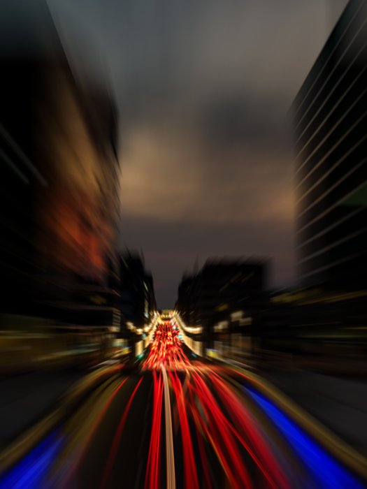 A blurry light trail photo using a radial blur filter in photoshop with the zoom blur to simulate zoom blurring for more artistic images.