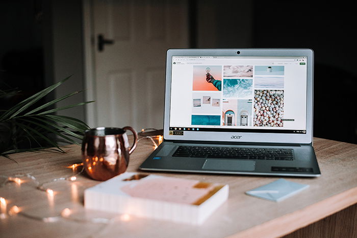 An open laptop with stock photography on the screen 