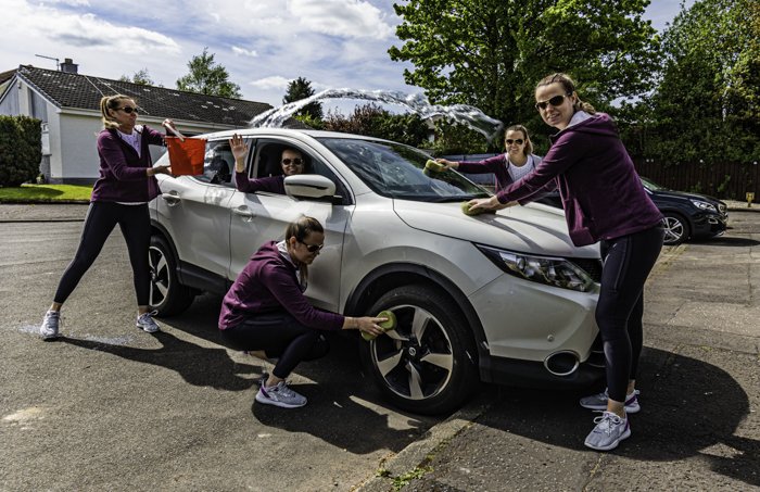 A multiplicity photo of a cloned woman washing her car