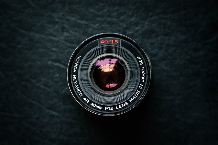 Camera lens on a black surface