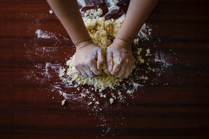 Overhead shot of hands kneading dough