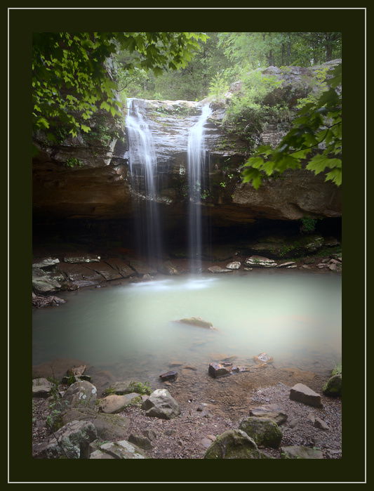 A beautiful flowing waterfall photo with green border