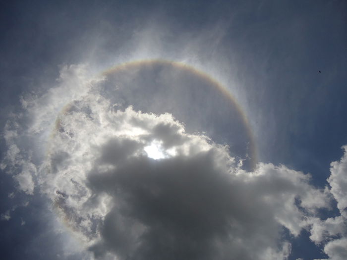 clouds obscure a solar eclipse