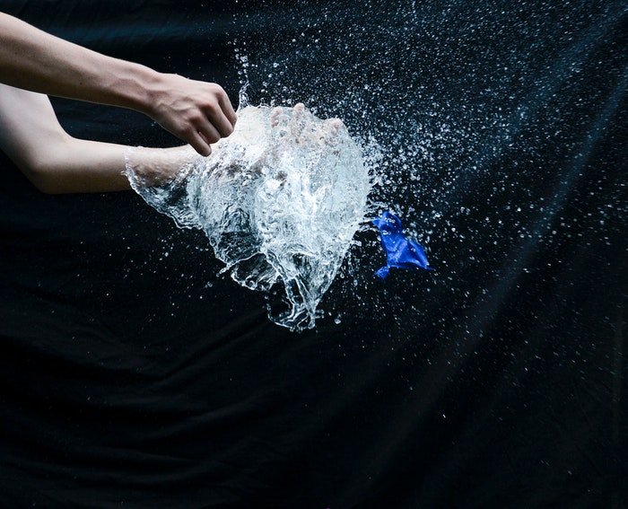 A water balloon exploding 