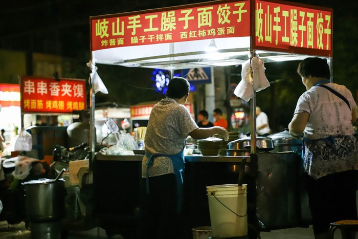 A street food market at night