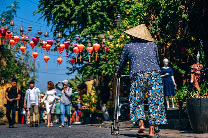 Old lady walking on the streets.