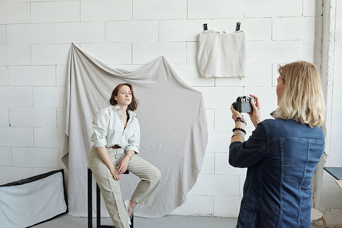 Photographer working with model.