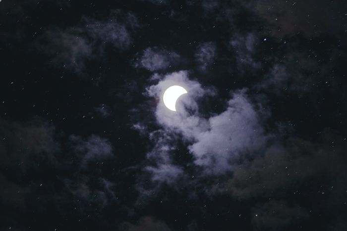 photo of the solar eclipse with clouds