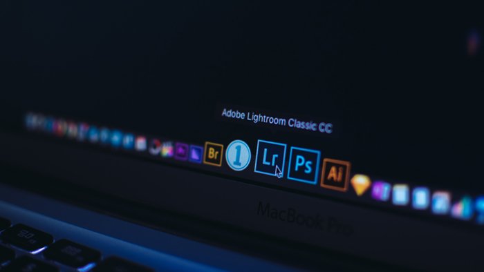 Photo of a Mac desktop with Adobe Lightroom and Photoshop