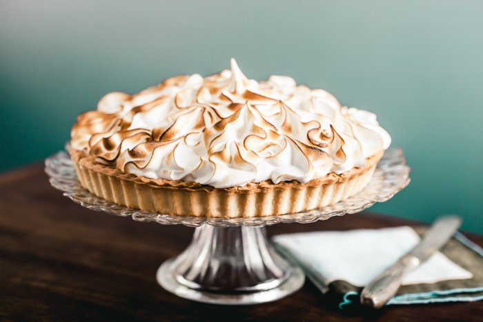 Lemon meringue tart on a cake stand