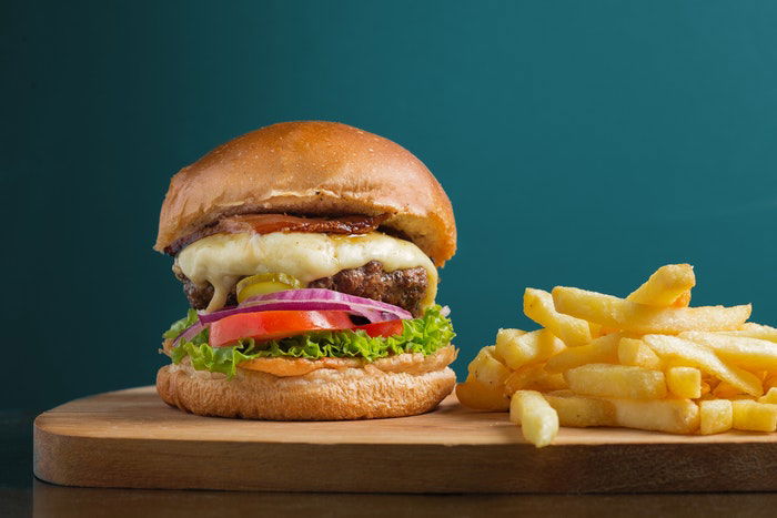 photo of a hamburger with a side of fries