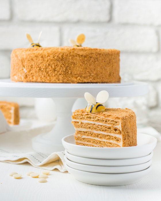 Bright and airy photo of a delicious cake on white plates