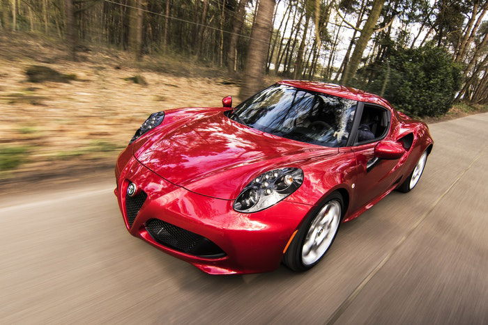 Photo of a red driving sports car