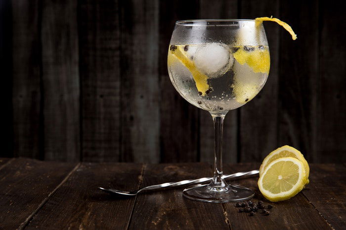 A citrus cocktail drink on a wooden table