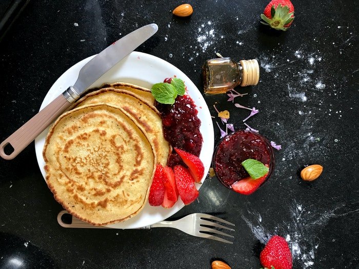 A flat lay photo of pancakes on a plate