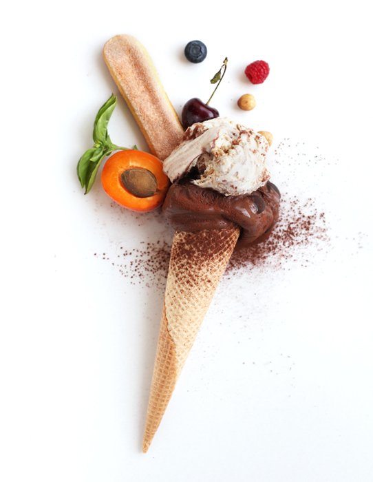 Flat lay photo of chocolate ice cream cone and ingredients