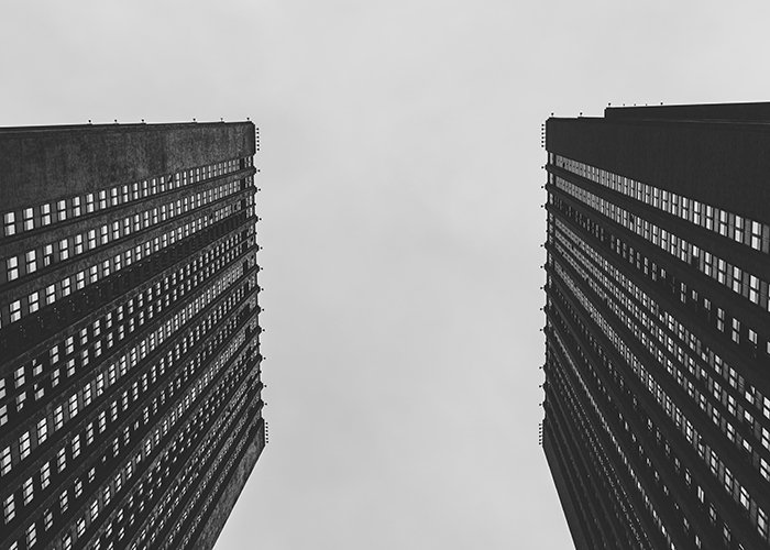 Low angle view of skyscrapers. Black and white photography.