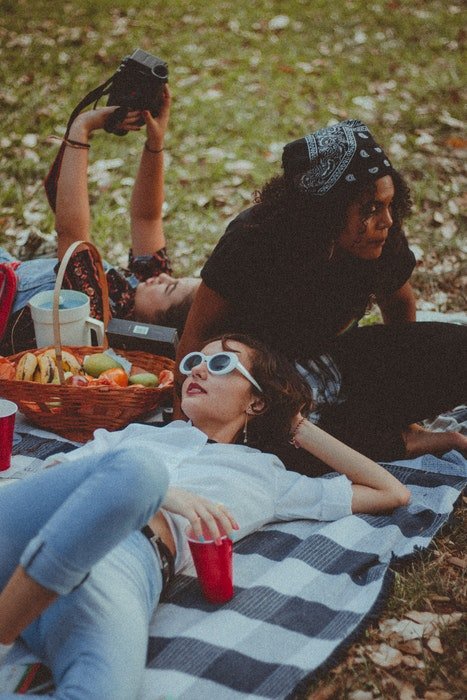 A group of girlfriends having a picnic