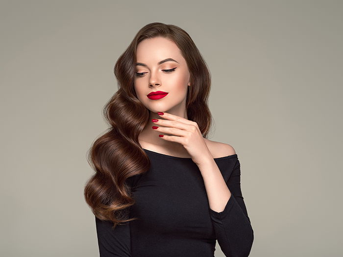 Portrait of a model wearing a red lipstick.