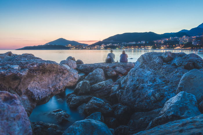 A rocky coastal scene at evening time