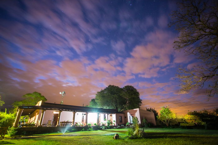 Long exposure of a house under clouds