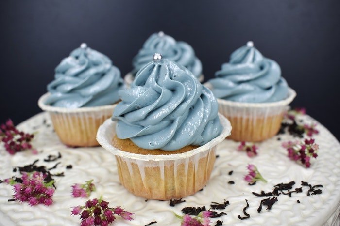 photo of cupcakes with blue frosting