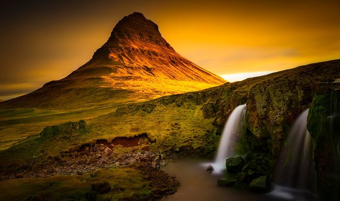 Beautiful long exposure landscape with mountain and waterfall