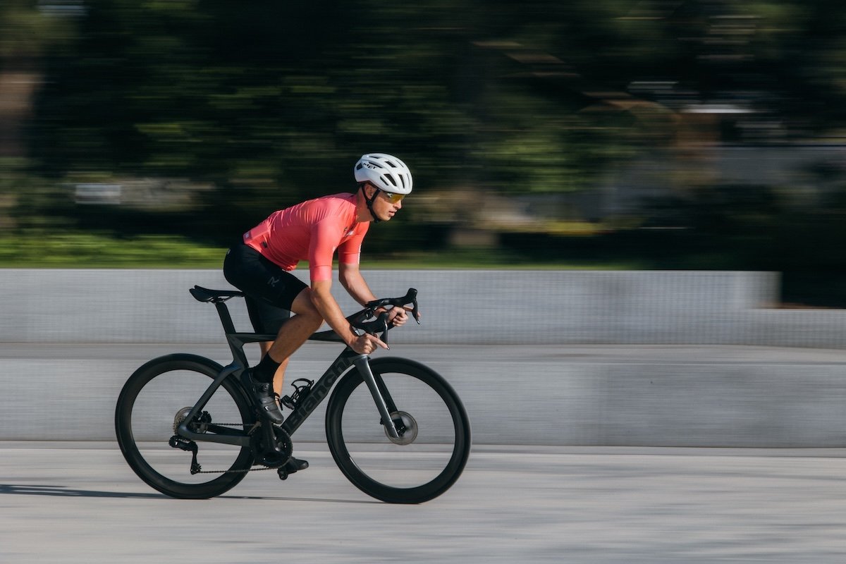 A cyclist riding a bike with a blurred background