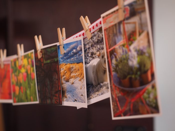 printed photos pegged on a string