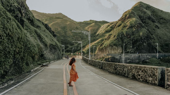 photo of a woman on a road edited in Lightroom