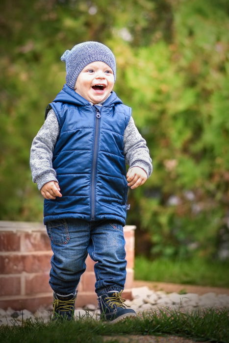 outdoor portrait of a running kid 