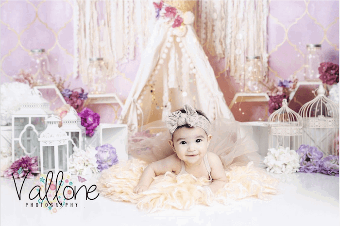 Baby in pink room from baby photographer Benedetta Vallone