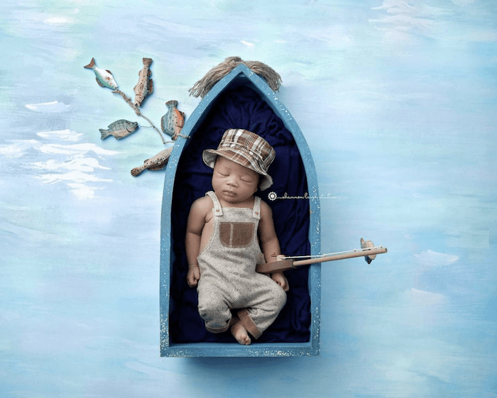 sleeping baby in fishing scene from famous baby photographer shannon leigh