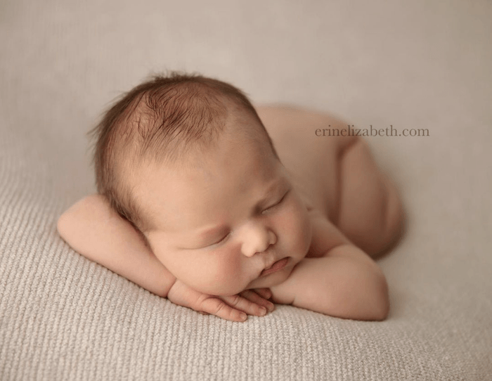 Baby asleep on sheet from famous baby photographer erin elizabeth hoskins
