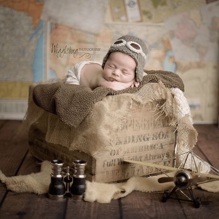 Baby dressed as a pilot from baby photographer Tricia Schumacher
