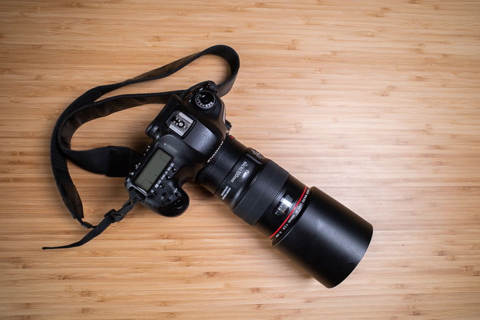 photo of the Canon EF 100mm f/2.8L attached to a camera body