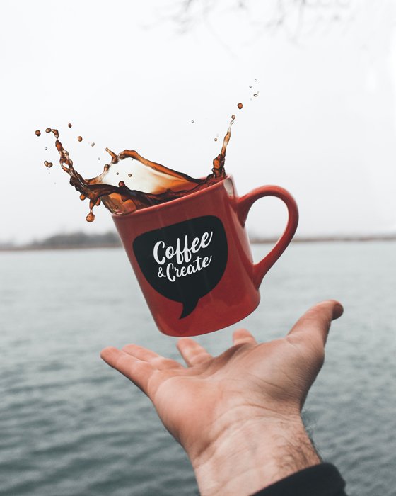 photo of a levitating coffee mug with a coffee splash