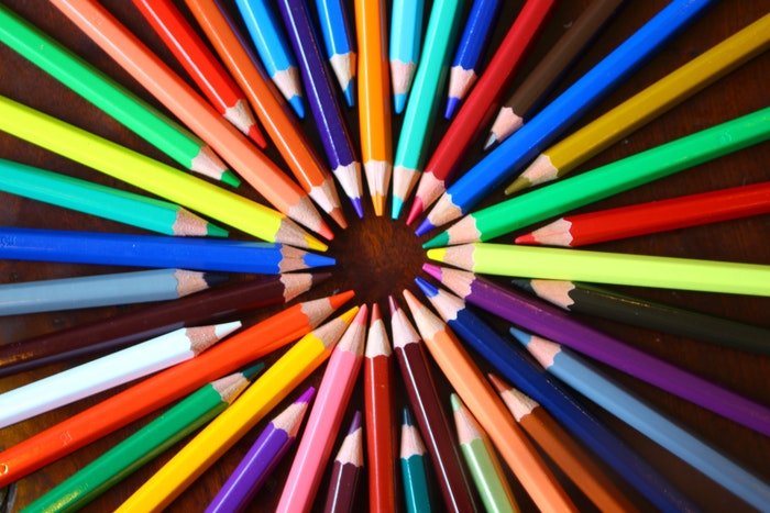 A circle of coloring pencils in various different bright shades