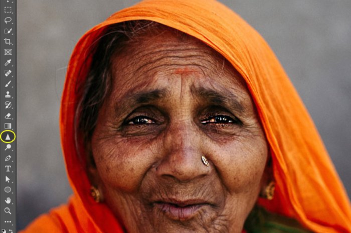 A screenshot showing image sharpening in Photoshop using a portrait of an Indian woman