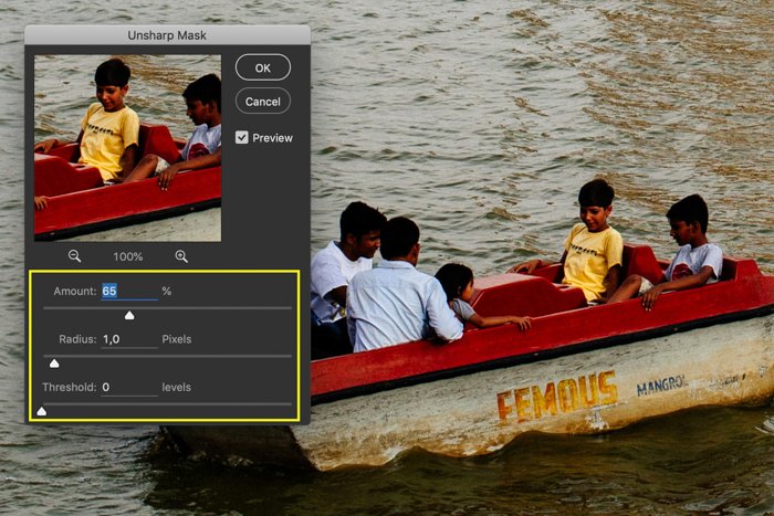 A screenshot showing how to sharpen images in Photoshop using a photo of a small boat in a lake