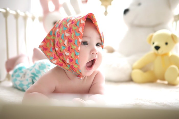 Cute newborn photo in a headscarf