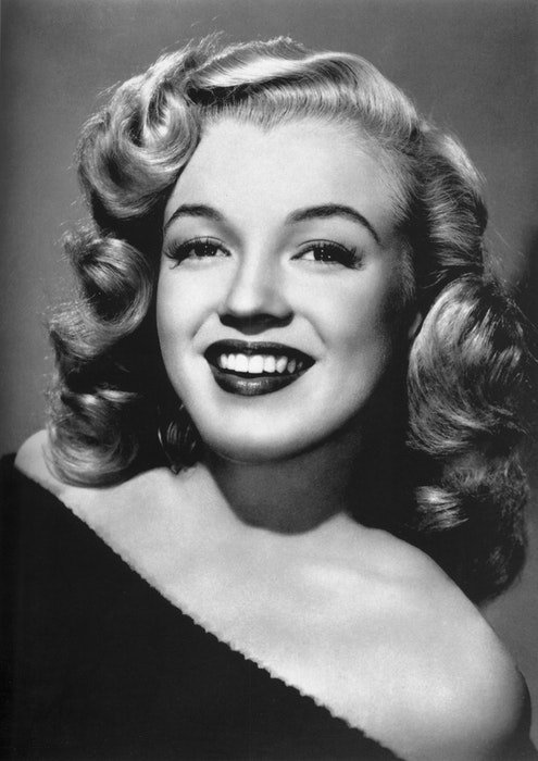 A black and white portrait of Marilyn Monroe