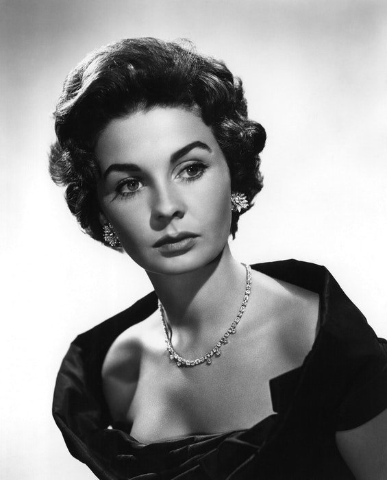 A black and white portrait of young Elizabeth Taylor