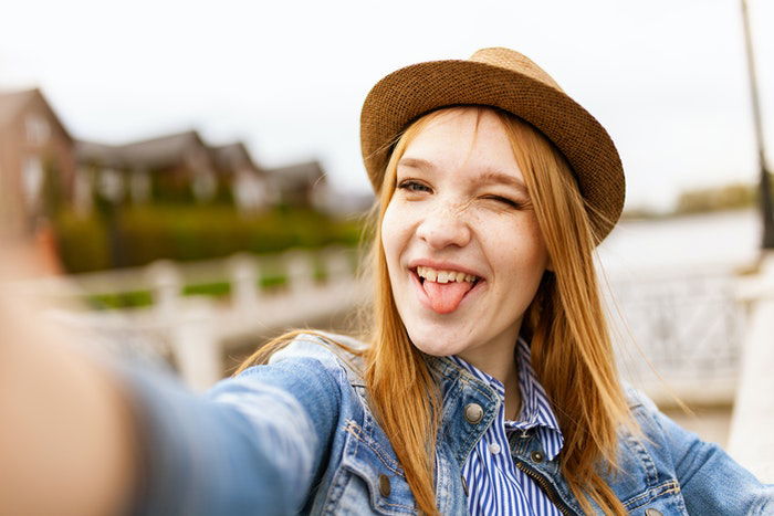 A girl in a silly selfie pose