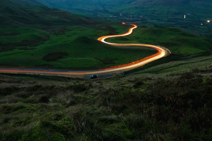 Light trails of traffic on a countryside road