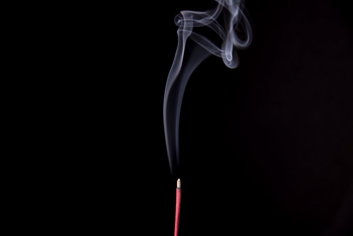Smoke trailing from an incense stick 