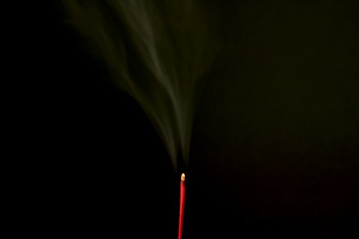 Smoke trailing from an incense stick 