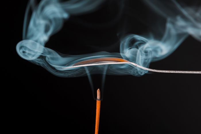 Smoke trailing from an incense stick 