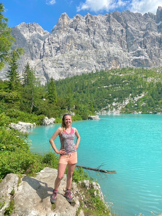 A casual Facebook profile photo of a girl posing in front of a stunning landscape