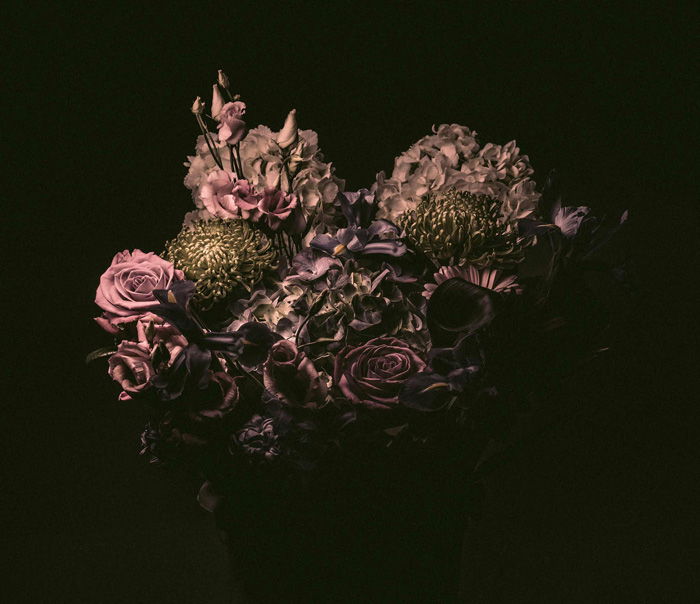 still life photo of a bouquet of pink flowers